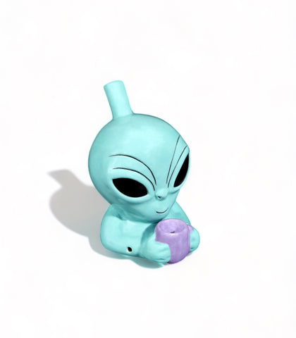 Alien Ceramic Pipe – 5-inch tall teal alien design with jet black eyes and lavender pipe, fully functional tobacco pipe by Fashioncraft, made of durable ceramic.