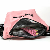 Inside view of Blazy Susan pink fanny bag showing compartments filled with pink rolling papers and insulated lining for secure storage.