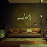 Chicago skyline neon LED wall art in warm white light displayed in a cozy living room, perfect for urban-themed interiors.