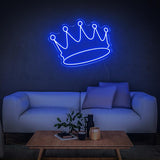  Blue crown LED neon sign on the wall in a stylish living room with a comfortable sofa.