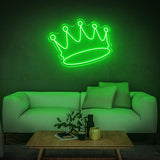 Green crown LED neon sign in a living room with contemporary decor and modern furniture.