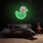 Duck LED neon sign with vibrant green and pink lights as unique wall decor for modern bedrooms.