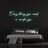 Green "Everything you need is inside you" neon sign for a refreshing bedroom wall design with modern vibes.