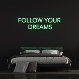 Follow Your Dreams neon sign with vibrant LED lighting, perfect inspirational wall decor for home, office, or bedroom.