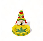  Gnome ceramic round ashtray with Rasta colored hat, raised leaf design, and three openings for smoking devices, perfect for smokers and collectors.






