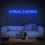 Bright blue 'Normal Is Boring' LED neon sign, perfect for adding a quirky and fun touch to any home or office space while celebrating individuality.