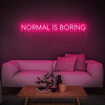 Fun and vibrant pink 'Normal Is Boring' LED neon sign, ideal for adding personality and flair to your space, encouraging originality and boldness.