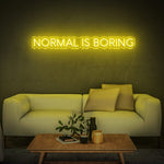 Eye-catching yellow 'Normal Is Boring' LED neon sign, a fun and bright addition to any space, reflecting creativity and a unique perspective.