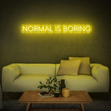 Eye-catching yellow 'Normal Is Boring' LED neon sign, a fun and bright addition to any space, reflecting creativity and a unique perspective.