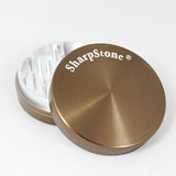 Durable SharpStone® 2.2" herb grinder with anodized aluminum and frictionless poly ring for smooth grinding.