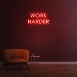 Work Harder red neon sign on a dark wall, perfect for gym or home decor, motivational LED neon sign for productivity.